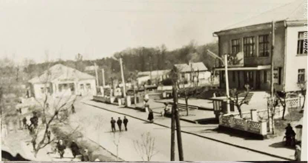 Another picture of the movie theater on the right and the restaurant in the back